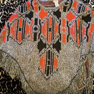 Poncho style sweater with sleeves